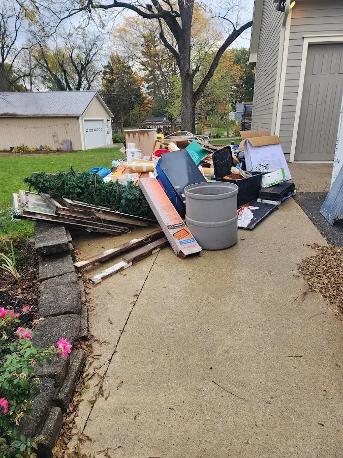 Dumpster being loaded with debris for 30 Yard Dumpster Rental in West Fargo